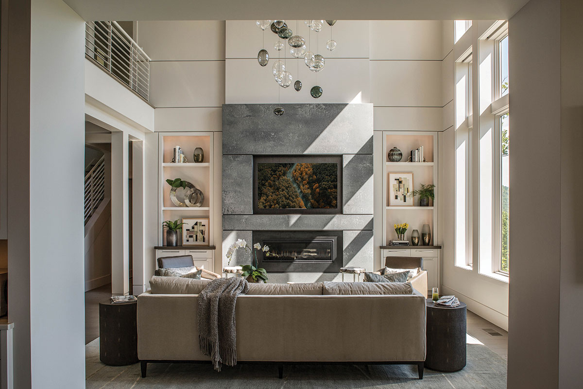 Living room, slab surround fireplace, custom glass bubble pendant light sculpture